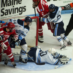 ORONO, MAINE -- 11/14/2014 -- University of Maine goalie Sean Romeo (center) makes a save on Boston University during their hockey game Friday Alfond Arena in Orono. Ashley L. Conti | BDN