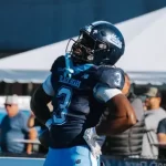 Maine holds on to pick up their first football win of the season; evens conference record