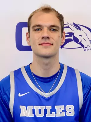 Poulton puts in 32 points as Colby snaps six game win streak for Husson men’s basketball